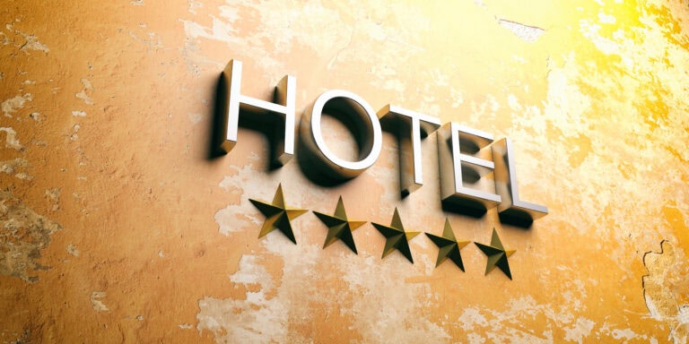 Five stars hotel sign on a stucco painted wall. 3d illustration